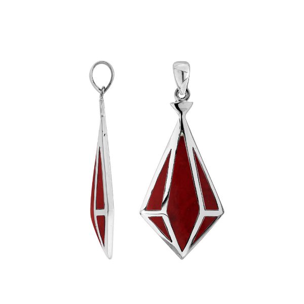 A handcrafted sterling silver pendant featuring a vibrant Red Coral encased in a geometric triangular frame, combining modern design and Balinese craftsmanship.