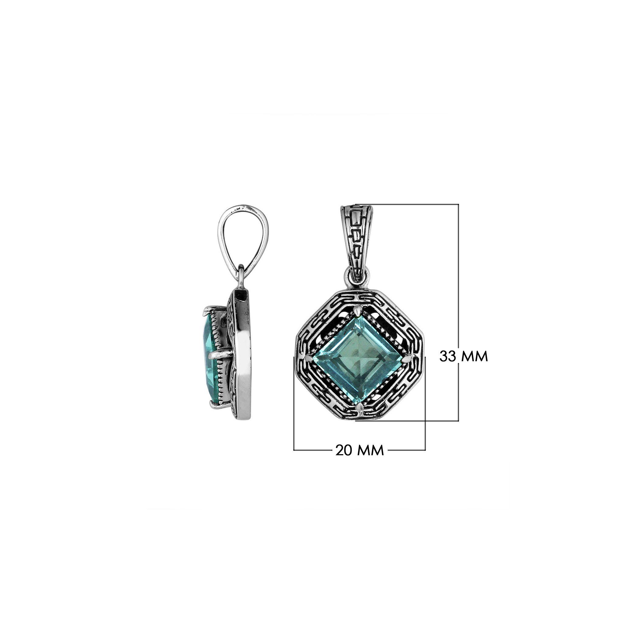 A handcrafted sterling silver pendant featuring a faceted Blue Topaz Quartz in a square Greek key frame, reflecting intricate Balinese artistry and craftsmanship.