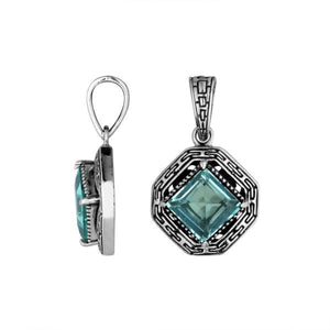 A handcrafted sterling silver pendant featuring a faceted Blue Topaz Quartz in a square Greek key frame, reflecting intricate Balinese artistry and craftsmanship.