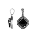 A handcrafted sterling silver pendant featuring a polished Black Onyx in a Greek key frame, showcasing exquisite Balinese detailing and fine craftsmanship.