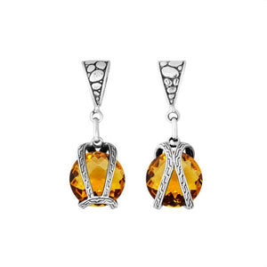 A handcrafted sterling silver pendant featuring a brilliant Citrine Quartz encased in a dual rope silver frame, reflecting Balinese craftsmanship and luminous detail.