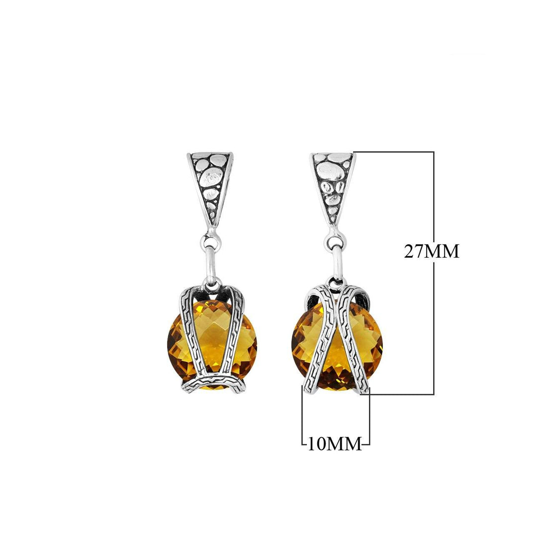 A handcrafted sterling silver pendant featuring a brilliant Citrine Quartz encased in a dual rope silver frame, reflecting Balinese craftsmanship and luminous detail.