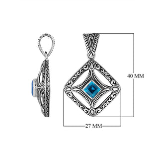 A handcrafted sterling silver pendant featuring a radiant Blue Topaz Quartz in a detailed Balinese filigree square frame with artistic silverwork.