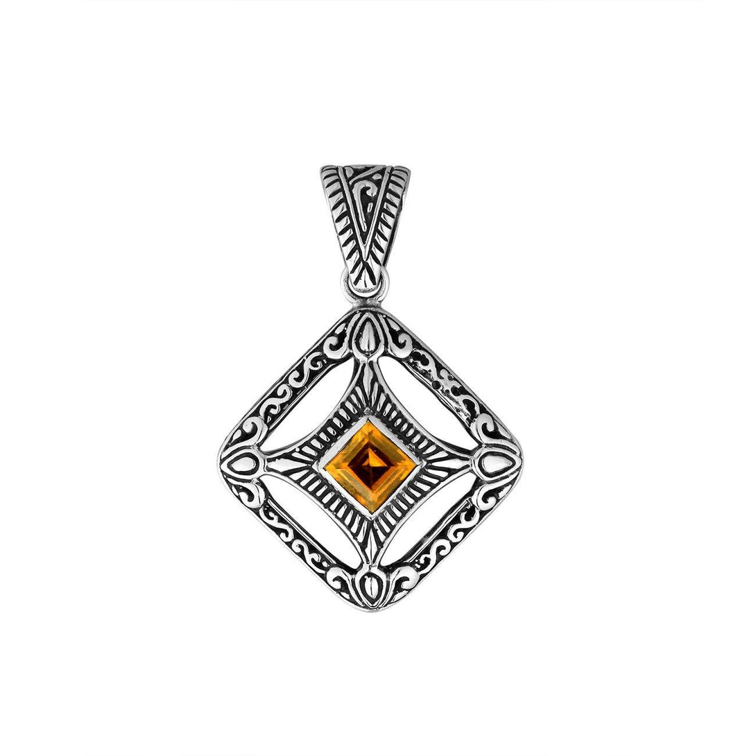 A handcrafted sterling silver pendant featuring a golden Citrine Quartz in an ornate Balinese filigree frame, showcasing fine silver artistry and elegance.