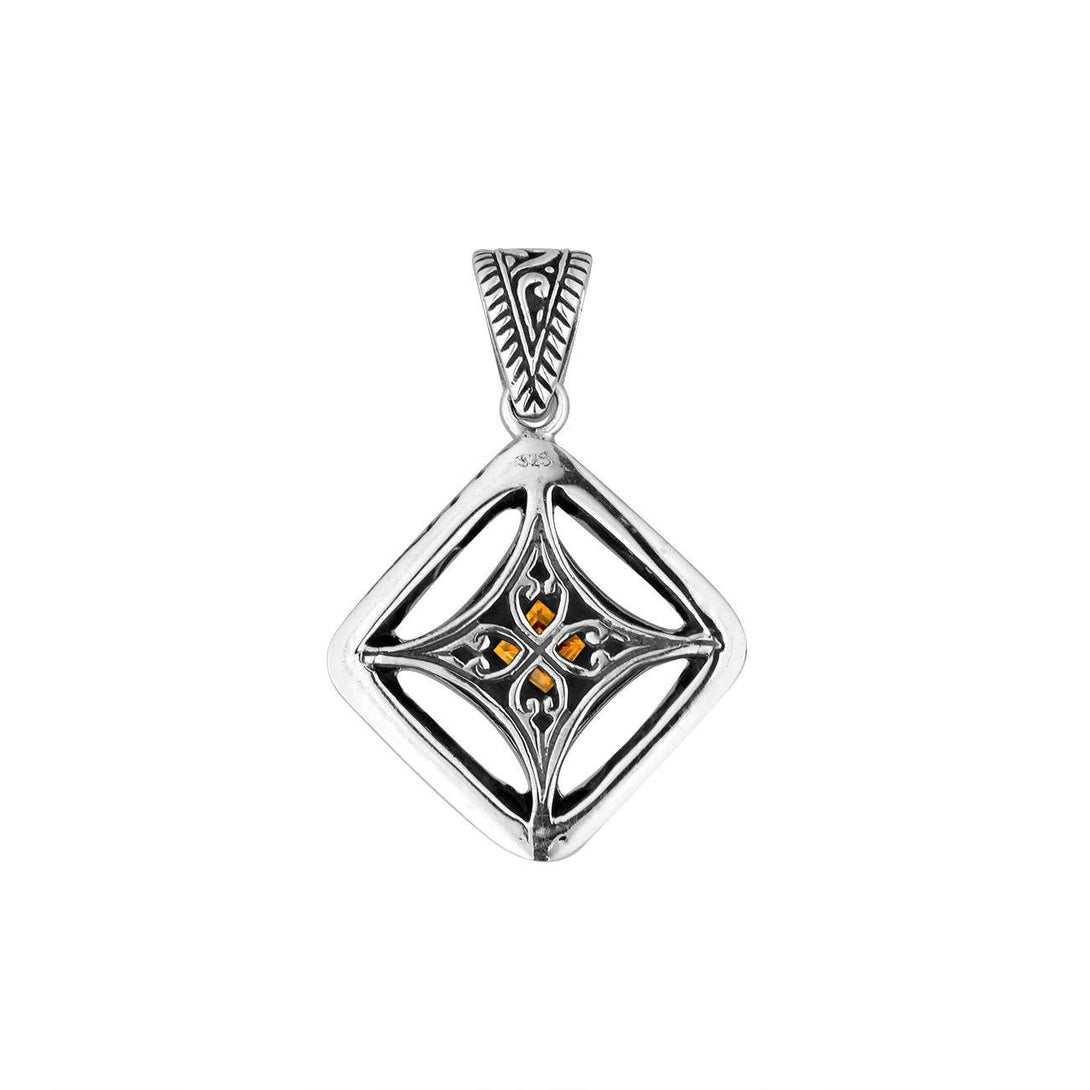 A handcrafted sterling silver pendant featuring a golden Citrine Quartz in an ornate Balinese filigree frame, showcasing fine silver artistry and elegance.