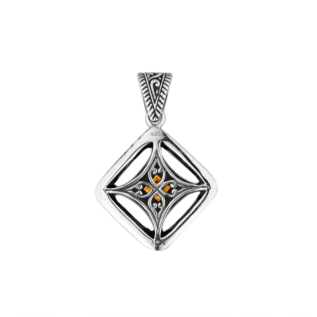 A handcrafted sterling silver pendant featuring a golden Citrine Quartz in an ornate Balinese filigree frame, showcasing fine silver artistry and elegance.