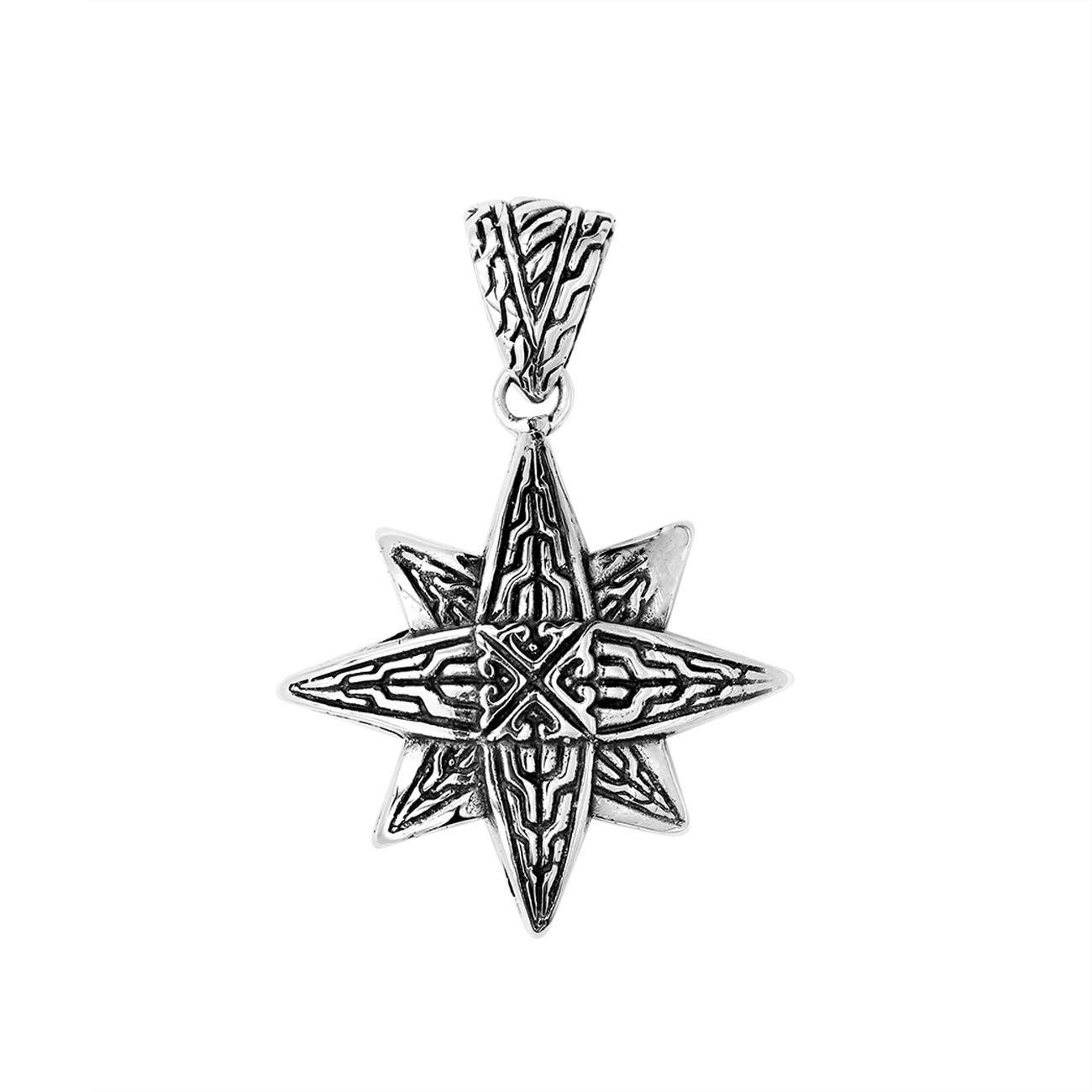 A handcrafted sterling silver compass star pendant featuring detailed Balinese tribal engraving and polished silver craftsmanship.