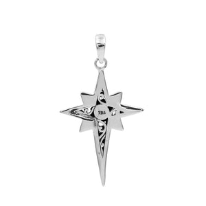 A handcrafted sterling silver compass star pendant featuring ornate Balinese filigree detailing and a high-polished finish.