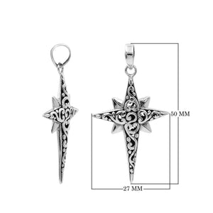 A handcrafted sterling silver compass star pendant featuring ornate Balinese filigree detailing and a high-polished finish.