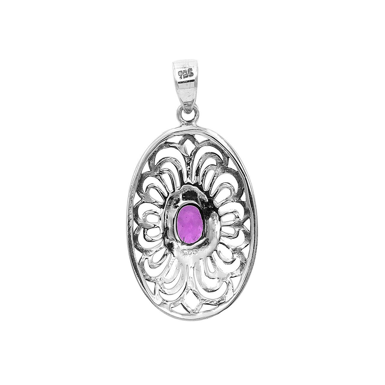 A handcrafted sterling silver pendant featuring a radiant Amethyst Quartz centered in a detailed Balinese filigree oval frame.