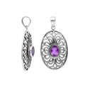 A handcrafted sterling silver pendant featuring a radiant Amethyst Quartz centered in a detailed Balinese filigree oval frame.