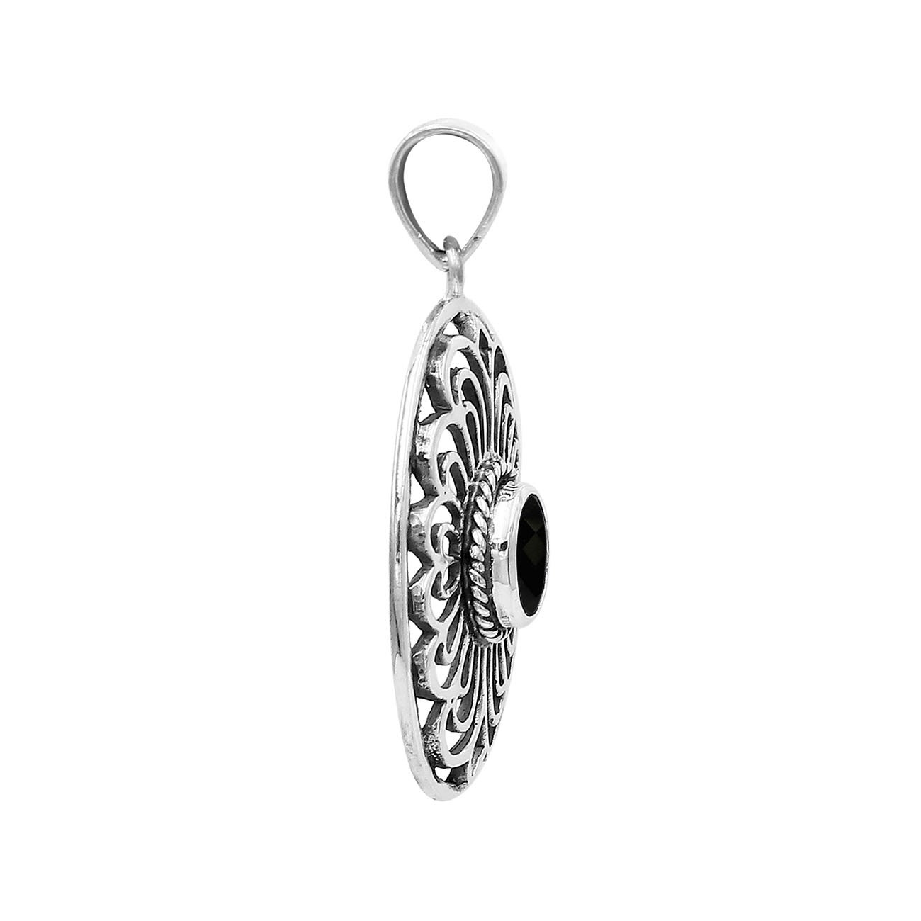 A handcrafted sterling silver pendant featuring a faceted Black Onyx in an elegant oval Balinese filigree frame.