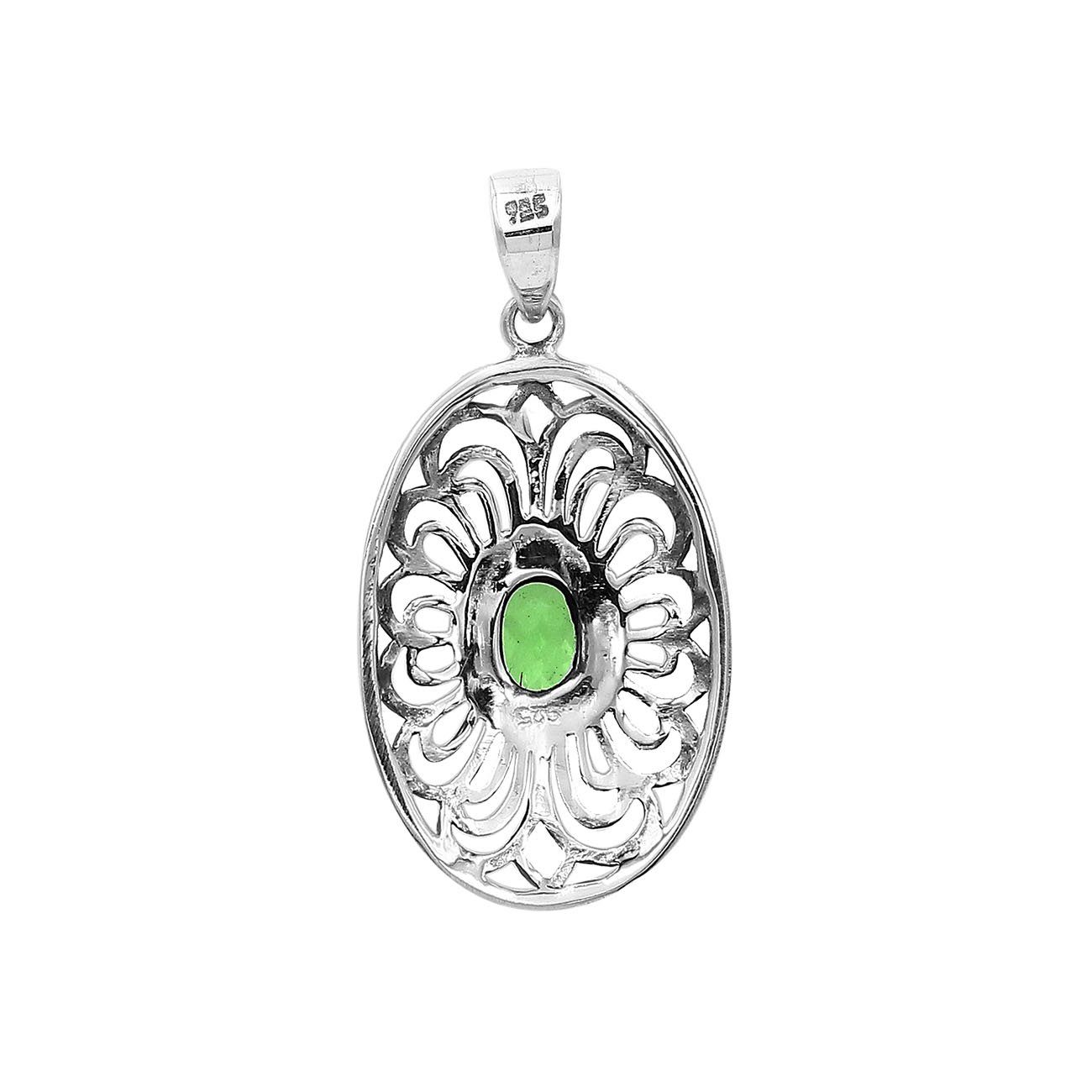 Handcrafted sterling silver pendant with Peridot Quartz  in an oval Balinese filigree frame and polished silver finish.