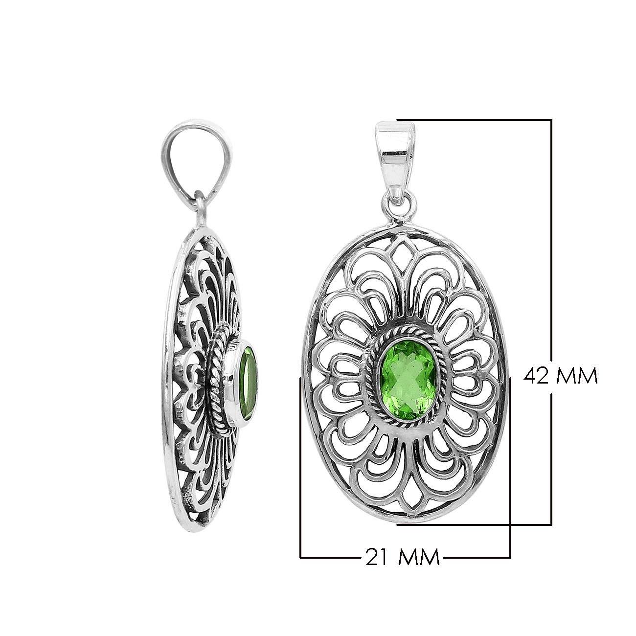 Handcrafted sterling silver pendant with Peridot Quartz in an oval Balinese filigree frame and polished silver finish.