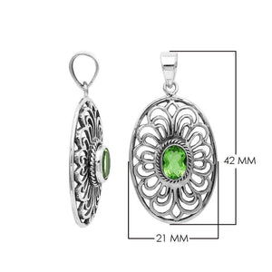 Handcrafted sterling silver pendant with Peridot Quartz in an oval Balinese filigree frame and polished silver finish.