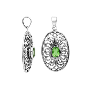 Handcrafted sterling silver pendant with Peridot Quartz in an oval Balinese filigree frame and polished silver finish.