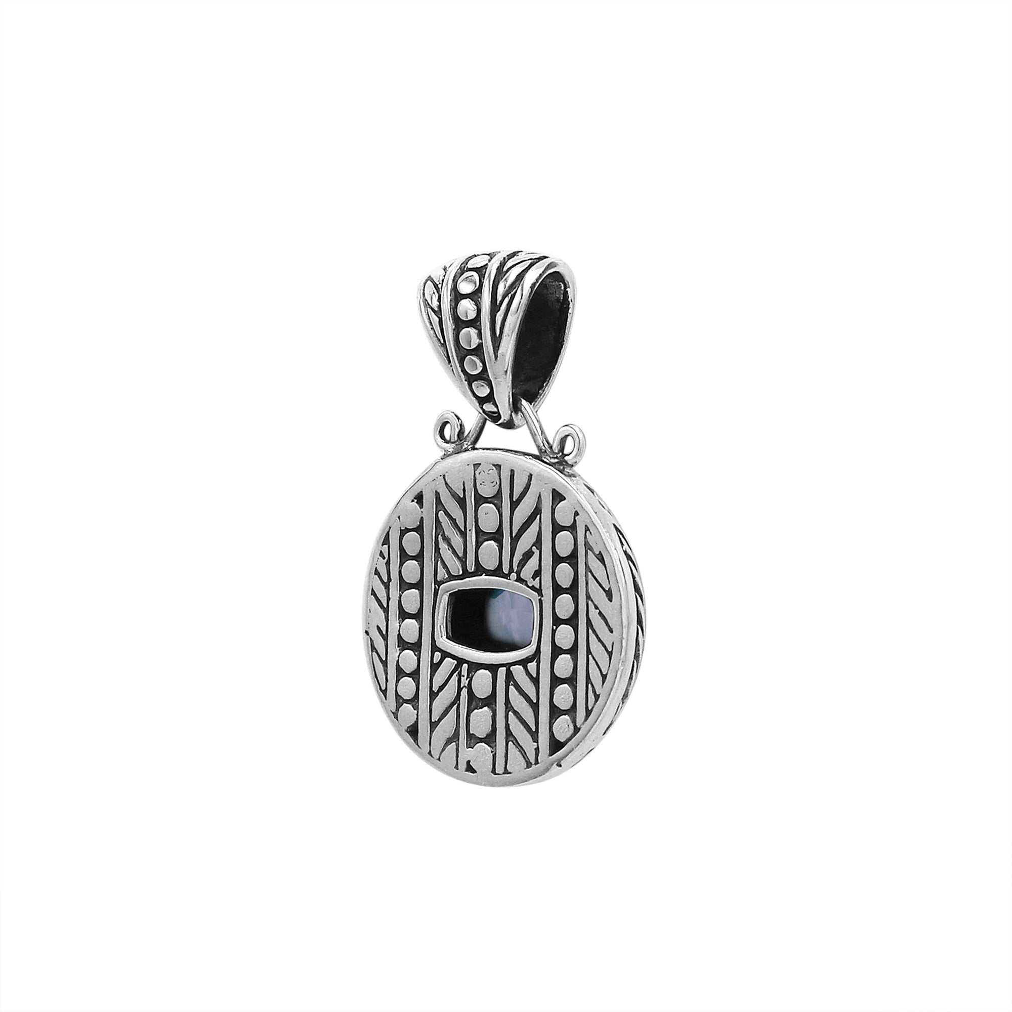 Sterling silver cushion pendant with Blue Topaz Quartz and handcrafted tribal Balinese oxidized detailing.