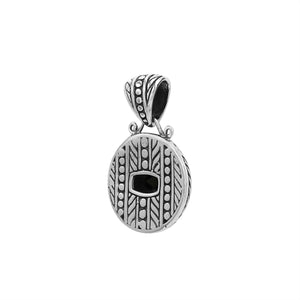 Round sterling silver pendant featuring cushion black onyx quartz, leaf carvings, dotted border, and smooth polished finish with Balinese detailing.