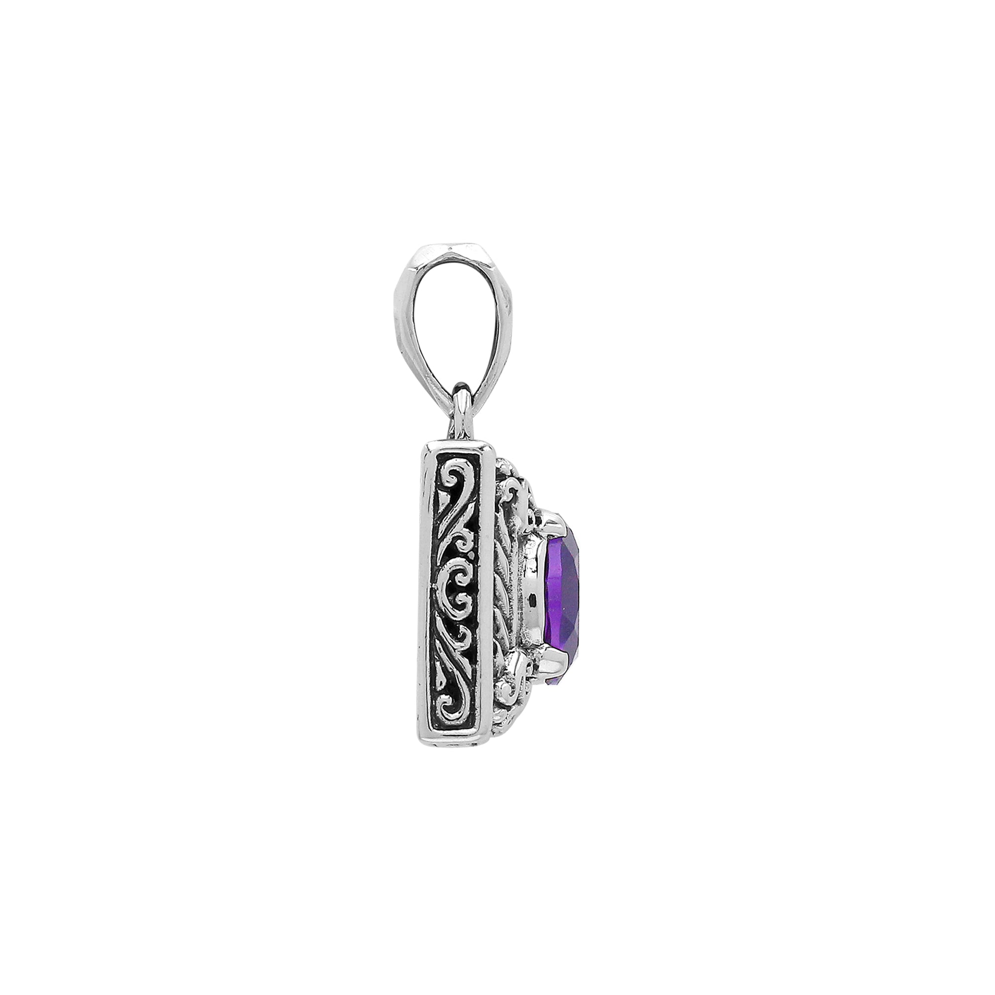 Rectangular sterling silver pendant featuring an oval amethyst quartz, detailed swirl patterns, and a smooth polished finish with traditional Balinese craftsmanship.