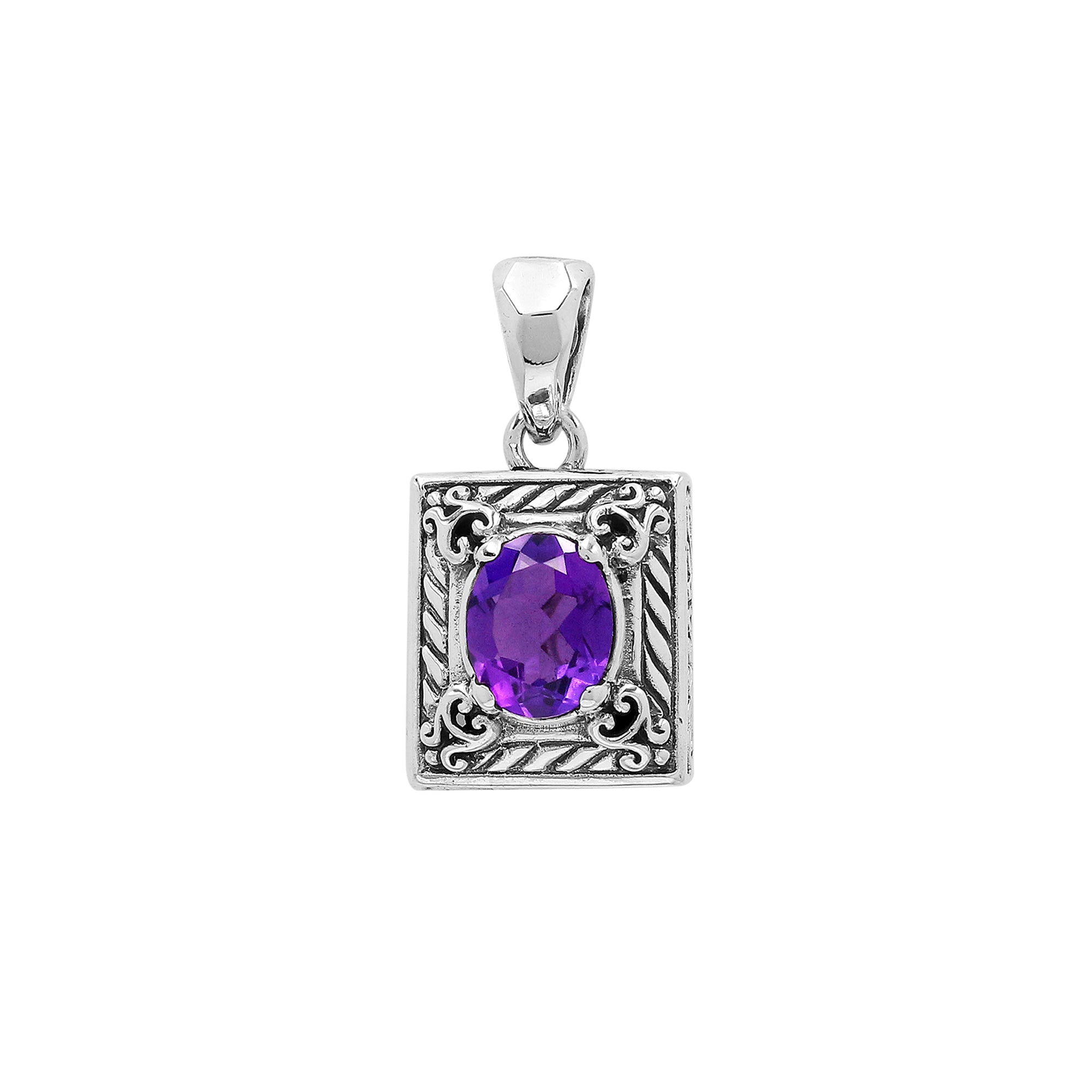 Rectangular sterling silver pendant featuring an oval amethyst quartz, detailed swirl patterns, and a smooth polished finish with traditional Balinese craftsmanship.