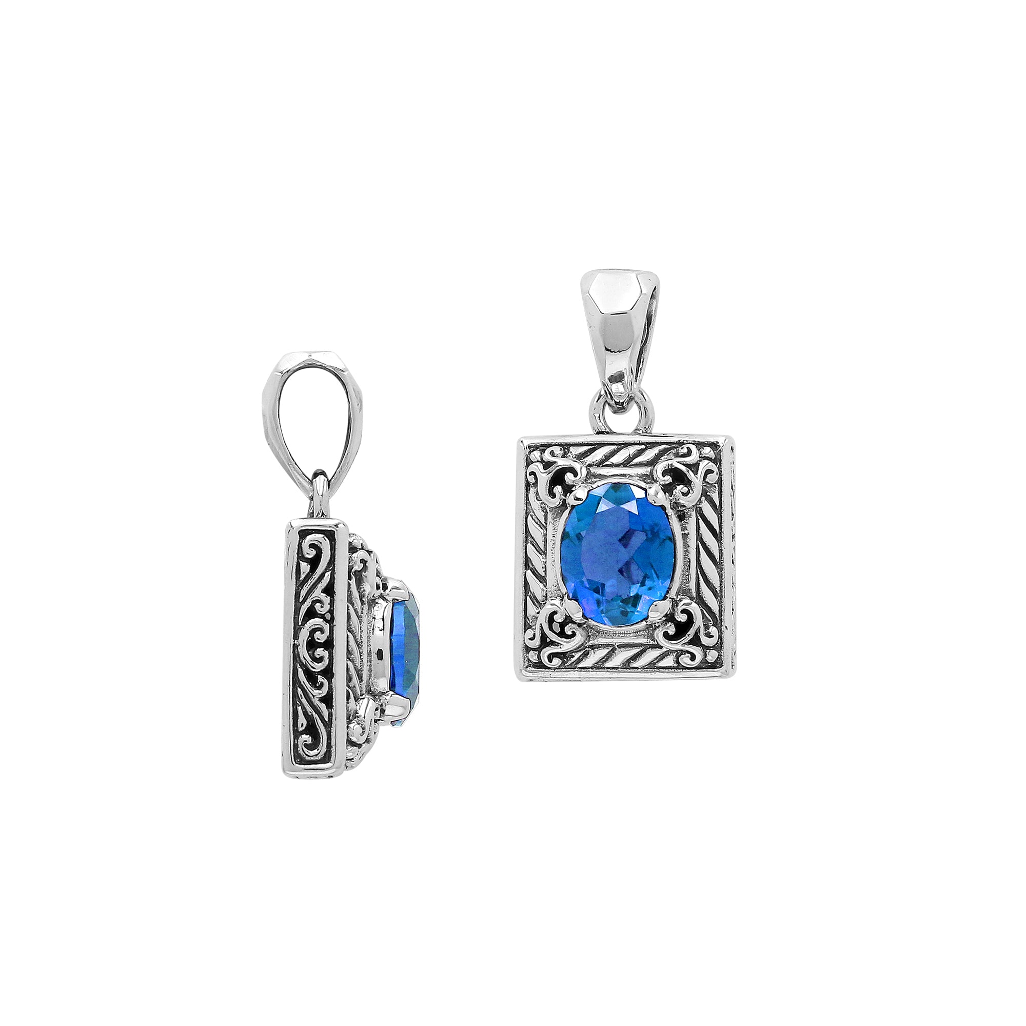 Rectangular sterling silver pendant featuring oval blue topaz quartz, swirl engravings, and smooth mirror-polished finish with detailed Balinese craftsmanship.