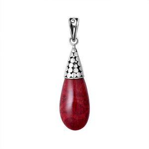 Sterling silver teardrop pendant featuring red coral with polished dot motif cap and Balinese handcrafted detailing.