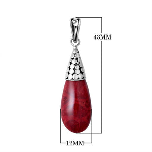 Sterling silver teardrop pendant featuring red coral with polished dot motif cap and Balinese handcrafted detailing.