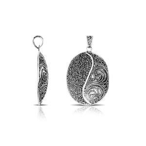 Sterling silver oval pendant featuring Yin-Yang filigree texture with oxidized handcrafted Balinese finish.