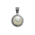 Sterling silver round pendant with Mabe Pearl and oxidized Balinese beaded handcrafted frame.