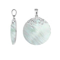 Sterling silver round pendant with Mother Of Pearl and elegant scroll detailing handcrafted in Bali.