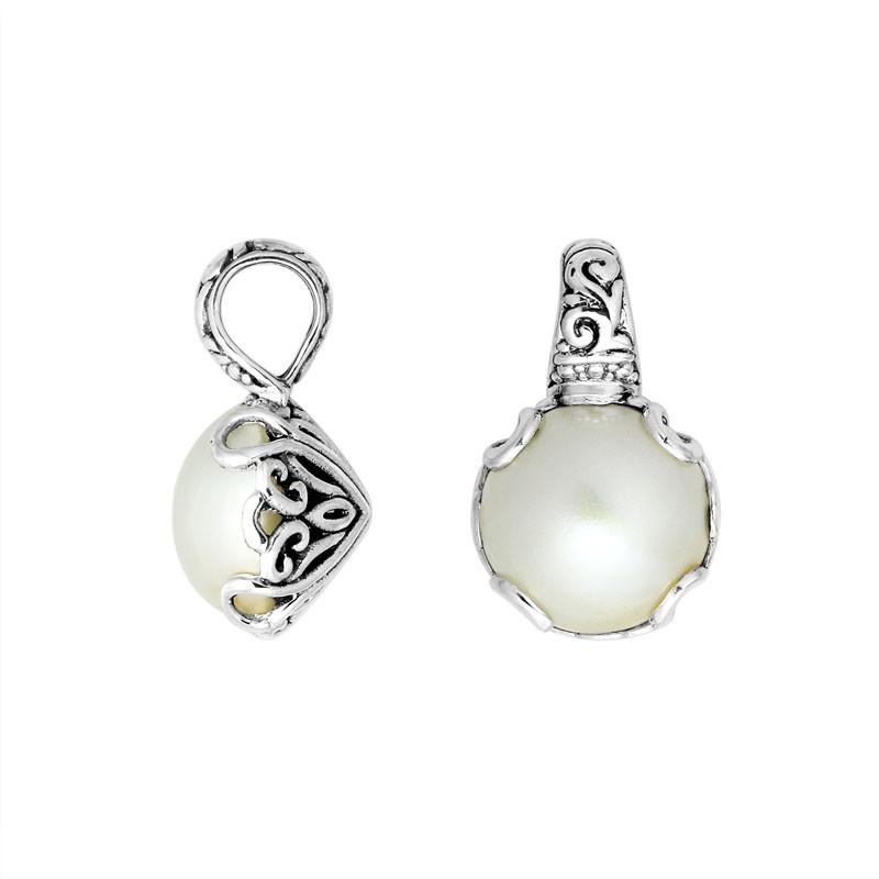 Sterling silver Mabe Pearl pendant with Balinese filigree and polished finish.