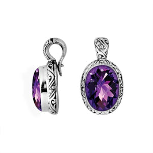 Sterling silver oval pendant featuring faceted Amethyst Quartz with detailed artisan metalwork.