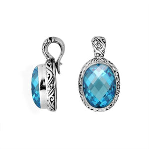 Sterling silver oval pendant with faceted Blue Topaz Quartz and Balinese detailing.