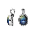 Sterling silver pendant featuring an oval Labradorite set in a carved traditional Balinese frame with polished shine.