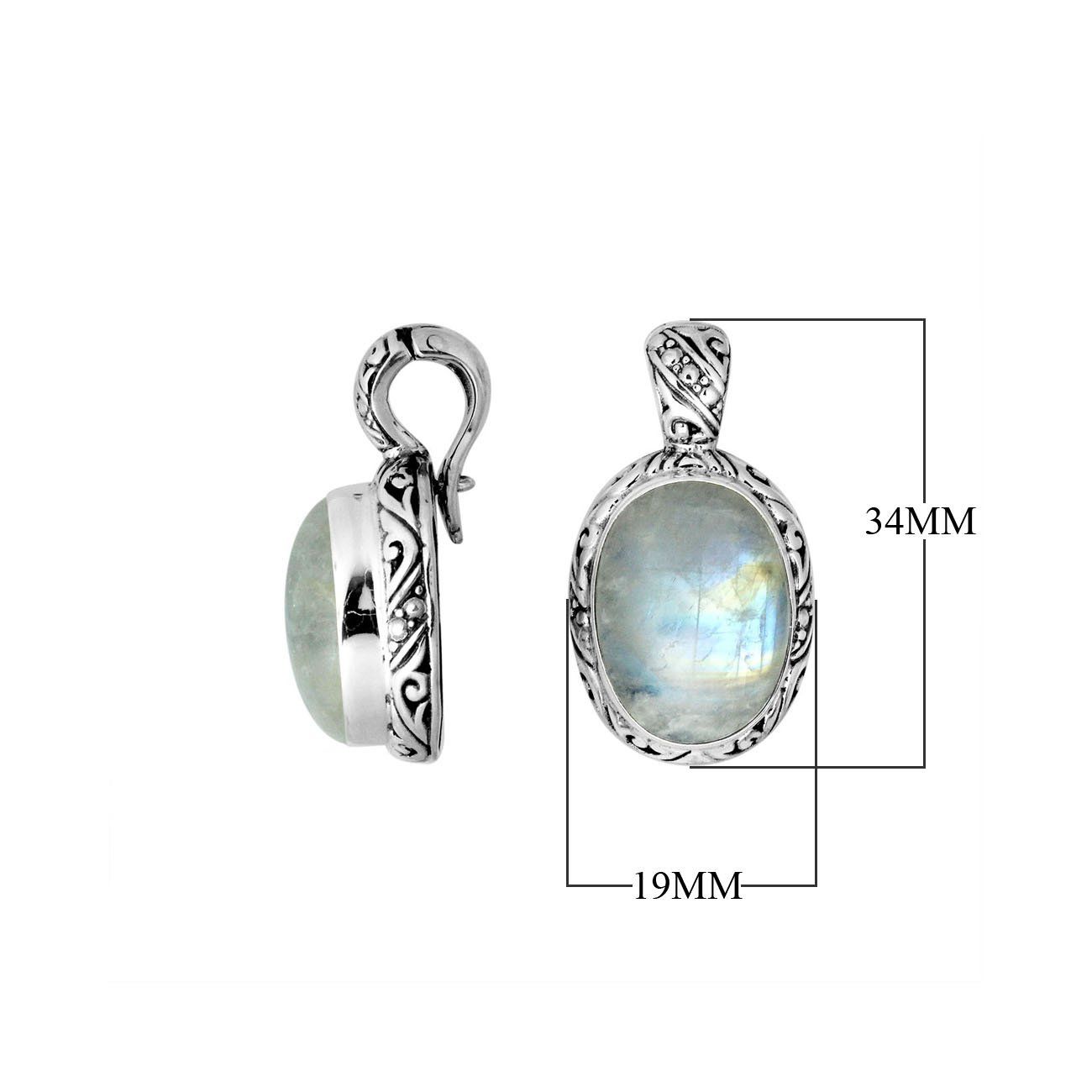 Sterling silver pendant featuring an oval Rainbow Moonstone set in a detailed Balinese carved frame with a polished glossy finish.