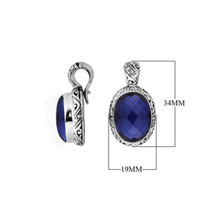 Sterling silver pendant featuring a faceted Blue Sapphire Quartz set in a carved Balinese frame with a polished glossy finish.