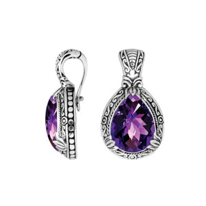 Sterling silver pendant showcasing a faceted Amethyst Quartz teardrop set in a carved Balinese frame with a polished finish.