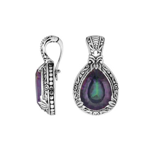 Sterling silver pendant featuring a teardrop Mystic Quartz set in a detailed carved Balinese frame with a glossy polished finish.