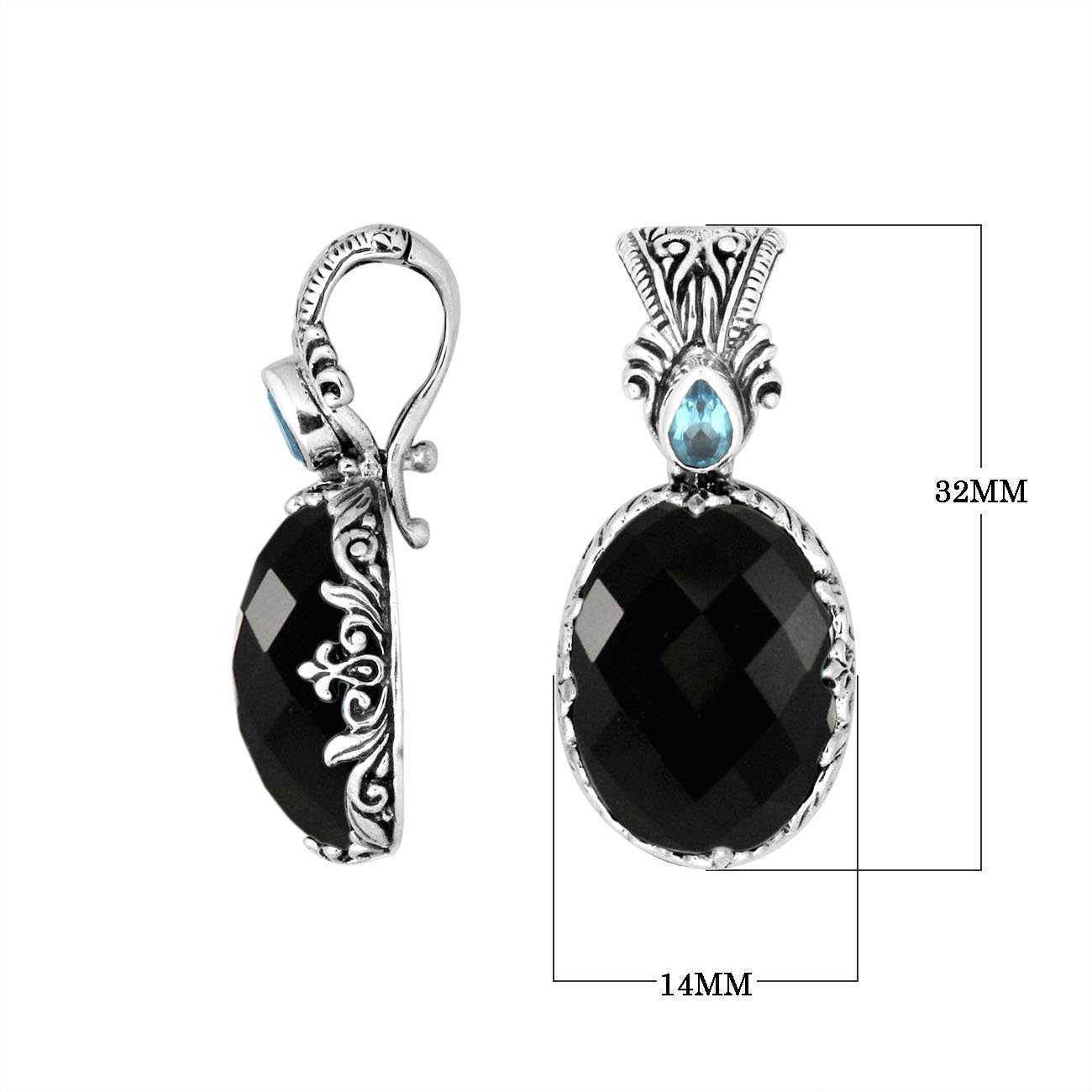 Sterling silver pendant featuring Black Onyx with Blue Topaz Quartz accent set in a carved Balinese frame and polished to a glossy shine.