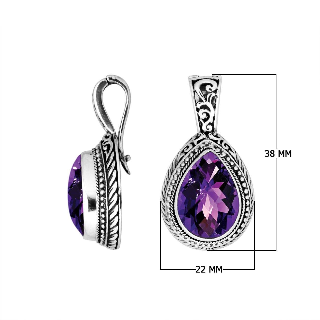 Sterling silver pendant featuring a faceted Amethyst Quartz teardrop set in a carved Balinese frame with a glossy polished finish.