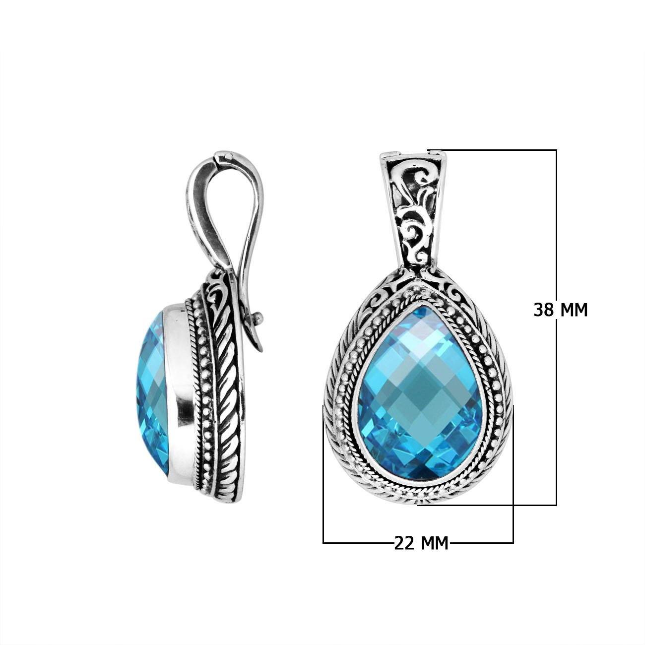 Sterling silver teardrop pendant featuring faceted Blue Topaz Quartz set in a carved Balinese frame with a polished glossy finish.