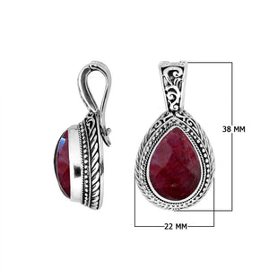 Sterling silver teardrop pendant featuring faceted Ruby Quartz set in a carved Balinese frame with a polished glossy finish.