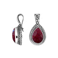Sterling silver teardrop pendant featuring faceted Ruby Quartz set in a carved Balinese frame with a polished glossy finish.