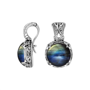 Sterling silver cushion pendant featuring Labradorite set in a carved Balinese frame with a polished high-gloss finish.