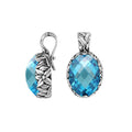 Sterling silver oval-shaped Blue Topaz Quartz pendant with floral detailing and enhancer bail, polished for brilliance and ideal for wholesale jewelry collections and catalogs.
