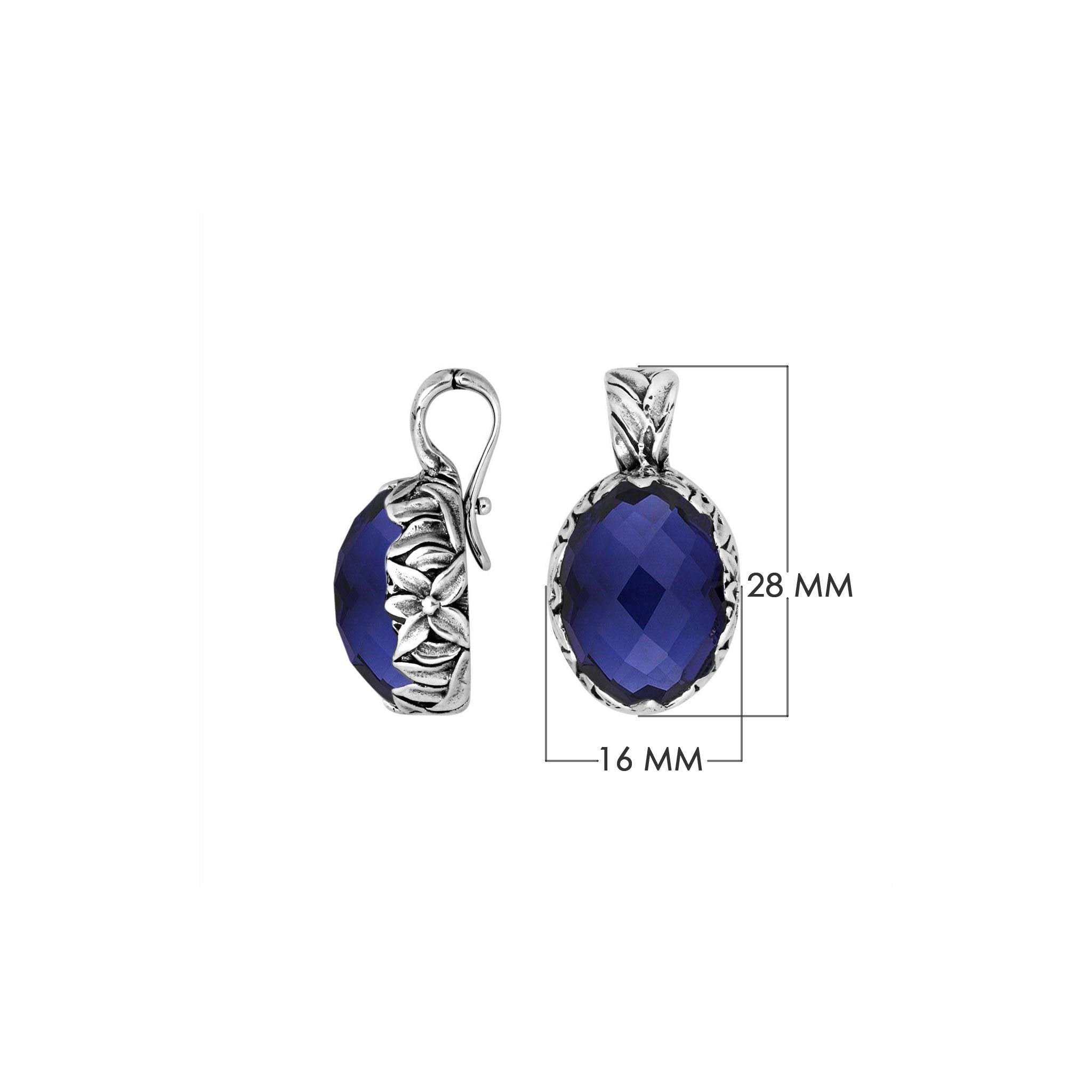 Sterling silver oval pendant featuring faceted Sapphire Quartz with Balinese floral engraving.