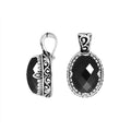 Sterling silver oval pendant featuring a deep Black Onyx center highlighted by intricate Balinese scroll carvings and a finely polished artistic frame design.