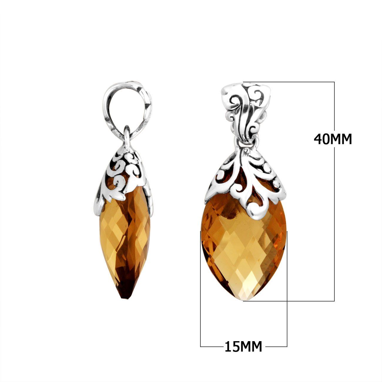 Sterling silver marquise pendant featuring a faceted Citrine Quartz center with intricately carved Balinese filigree detailing and a polished decorative frame.