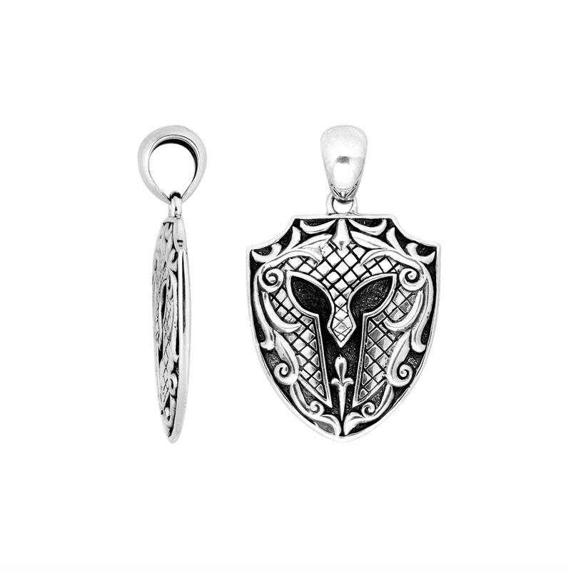 Sterling silver shield-shaped pendant featuring an engraved warrior helmet design with textured detailing and polished borders suitable for classic wholesale jewelry collections