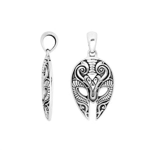 Sterling silver mask-shaped pendant featuring engraved tribal detailing, polished borders, and textured elements suitable for classic wholesale jewelry collections and retail displays